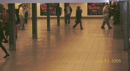 Busy Union Square Station with Warrior murals in the background